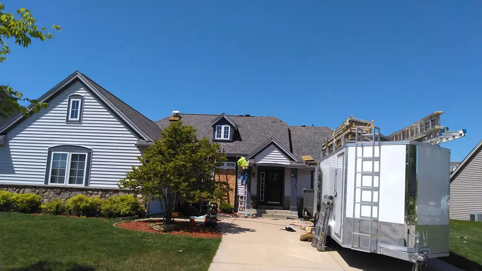 Home in East Troy in the process of getting asphalt roofing