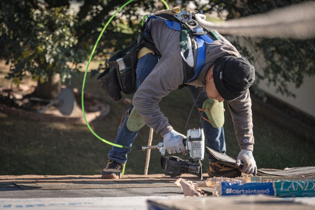a team of Highly Rated Roof Repair specialists fixing a roof