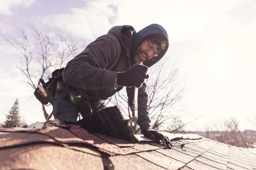 Roofing expert installing a roof on a home in Wales, WI.