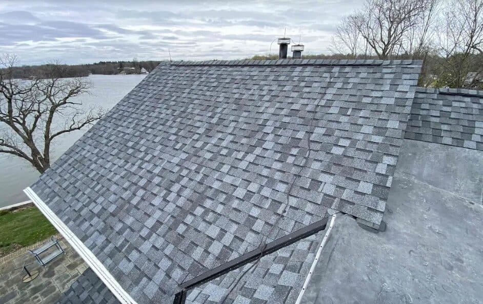 Close-up texture of asphalt roofing shingles with granules